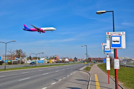 This is a view of WizzAir plane Airbus A320 over the street in Warsaw. April 1, 2017, Warsaw, Poland.のeditorial素材