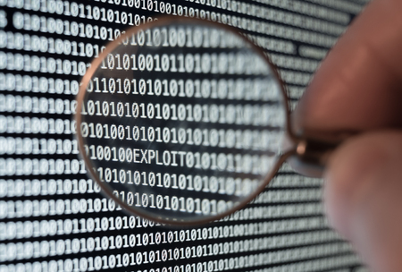 Exploit found with magnifying glass lupeの写真素材