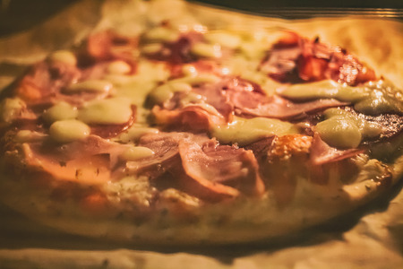 Homemade Pizza in Ovenの写真素材