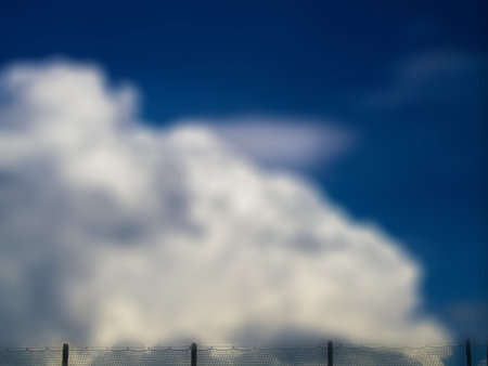 Blurred Sky Background with small fence, space for text