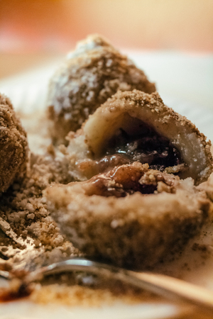 Close up Plum fruit dumplings with brown sugarの写真素材