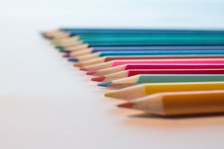 Colored Pencils isolated on white backdrop selective focusの写真素材