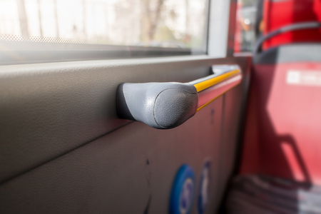Side holding handle in public Bus transportationの写真素材