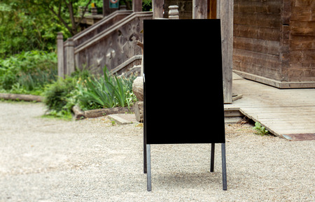 Blackboard mock up against rustic wood cabinの写真素材