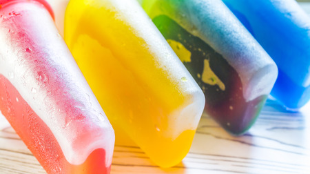 Frozen homemade ice pop in a mold meltingの写真素材