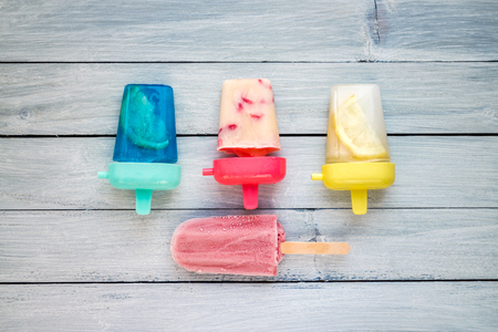 Various Homemade frozen dessert on blue pale wooden backdropの写真素材