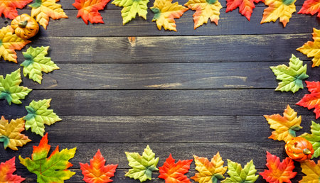Colorful flat lay of Autumn leaves on rustic wooden table, copy space