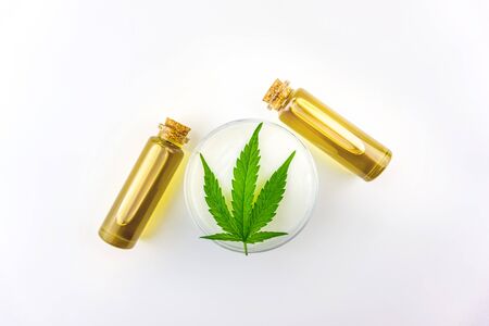 Cannabis oils in glass bottles and CBD lotion gel isolated on whiteの写真素材