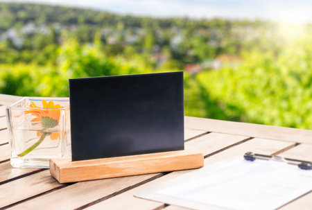Table top with a Blackboard template against vineyard, advert conceptの写真素材