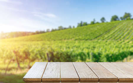 Table top with a Blackboard template against vineyard, advert conceptの写真素材