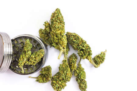 Joint essentials on white, flower buds grinder, medical or recreational marijuana conceptの写真素材