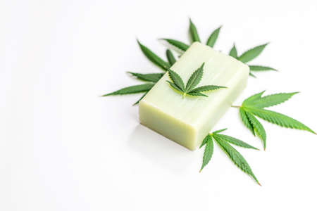Cannabis CBD infused natural soap and hemp leaf isolated on whiteの写真素材