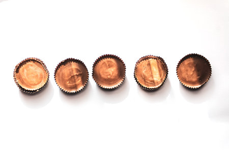 Peanut butter filled candy with chocolate frosting isolated on white background