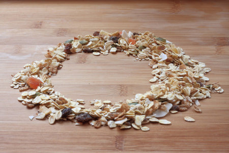 Muesli on a wooden kitchen tableの写真素材