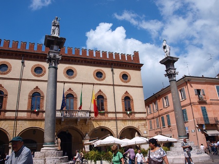 Tourists at the Piazza del Popolo, Ravenna, Italy. In the background, the Little Venetian Palace and two columns with the statues of St. Vitalis and St. Apollinare.のeditorial素材