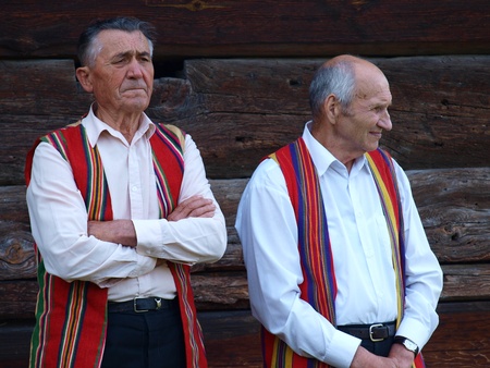 Two senior gentlemen from the rites team Hansk talking about the customs of the Night of St. John, an old Polish (and Slavic) folk event, June 24th 2011, Open-Air Museum of the Lublin Region Village, Lublin, Polandのeditorial素材