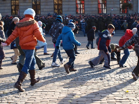 Celebrations of the Independence Day, Lublin, Poland, 11th November, 2011. Children collecting bullet cases after an honorary salvo.のeditorial素材