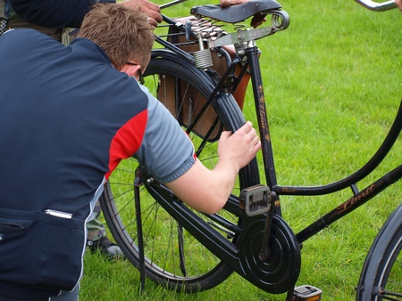 A man repairing his bike. Planet Lublin, a biking event in Lublin, Poland, May 30th 2010のeditorial素材