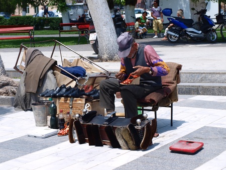 A man cleaning shoes in a street, Prilep, Macedoniaのeditorial素材