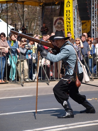 Musketeer firing a musket. Historical reenactment from period of 18th century, Lublin, Poland, April 21st 2012.のeditorial素材