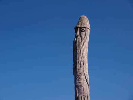 One of the wooden totem poles representing an idol surrounding an old early-medieval burg and settlement in Zmijowiska, Polandの写真素材
