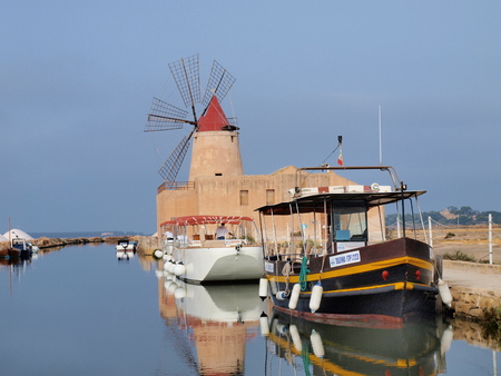 The windmill Ettore Infersa and the saltpans near the island of Mozia, Marsala, Sicily, Italyのeditorial素材