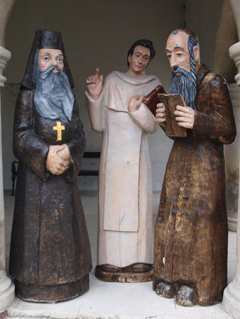 Three men representing existance of three religions in Wodawa, Poland