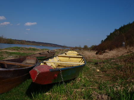 Boats on the river shore Vistural, M??mierz, Polandのeditorial素材