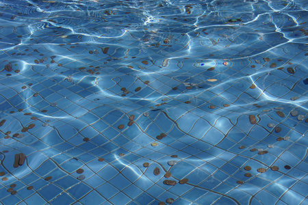 Clear transparent water pool with coins