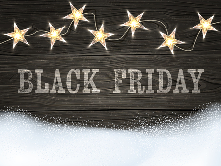 Black Friday sign on wooden background with star-shaped lights and snow.のイラスト素材