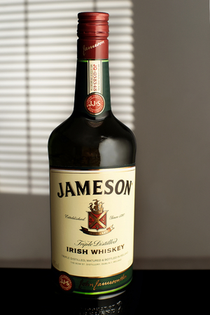 MINSK, BELARUS-AUGUST 25, 2016. A bottle of Irish whiskey "Jameson" is on the table.のeditorial素材