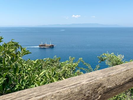 A ship sailing by the sea near the holy mount Athosの写真素材