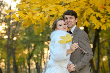bride and groom in autumn park Love Lifeの写真素材
