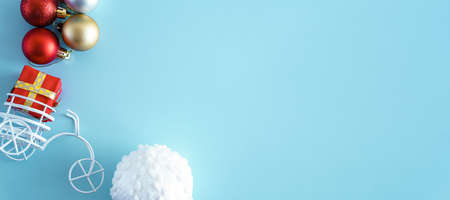 Banner Blue Christmas background with gift box tree toys red, gold and white color. toy bike with trunk carries box from Santa. Xmas, winter, new year concept. Flat lay, top view, overhead. Copy spaceの写真素材