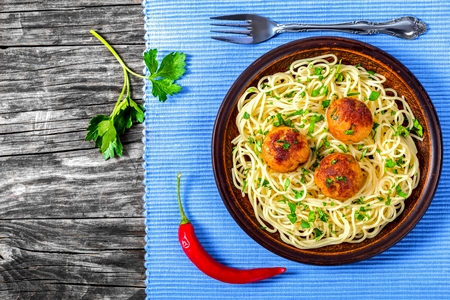 pasta spaghetti with fried meatball and parsley, top viewの写真素材