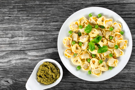 tortellini with green peas, fried Pine nuts,  top viewの写真素材