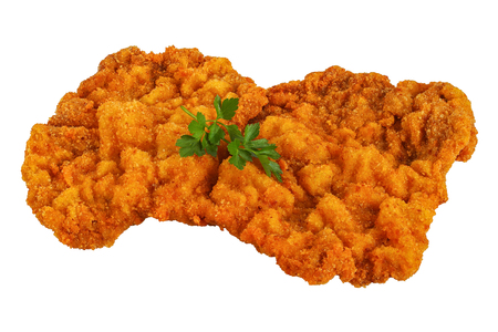 delicious golden brown classic Wiener schnitzel - or breaded veal cutlets isolated on white background, side viewの写真素材