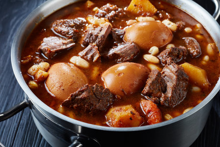 close-up of Traditional Jewish Cholent Hamin - main dish for the Shabbat meal, slow cooked beef with...