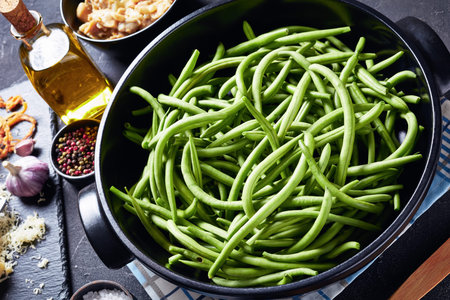 ingredients for classic thanksgiving casserole. fresh green bean in a black dish, crispy french...