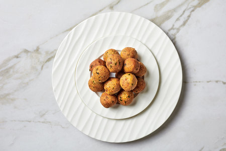 Mediterranean deep-fried falafels, of chickpeas with spices with coriander and cumin on a black...