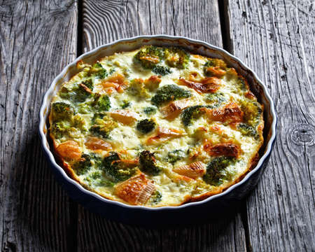 Crustless Broccoli Quiche gluten free baked with brie and cheddar cheese, horizontal view from aboveの写真素材