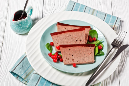Duck liver pate with cranberry jelly on a plateの写真素材