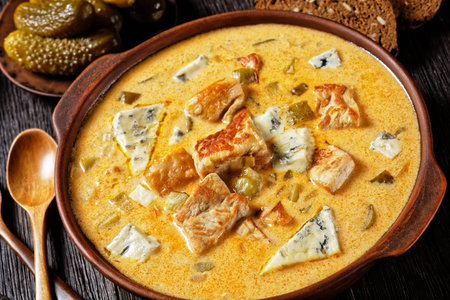Pork stew with cream, pickles, and blue mold cheese cooked of lean pork fillet with smoked paprika...