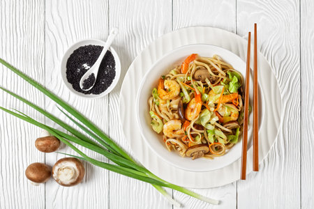 Prawn Yaki Udon, stir fried udon noodles with shrimps, cabbage, chestnut mushrooms, spring onion,...