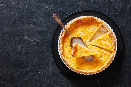 chess pie pairs a traditional butter pie crust with a sweet, custardy filling in white baking dish...