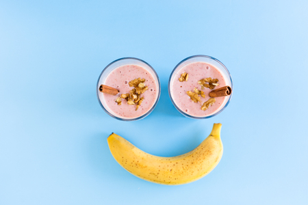 Fresh milk, strawberry drink in shape of smileの写真素材