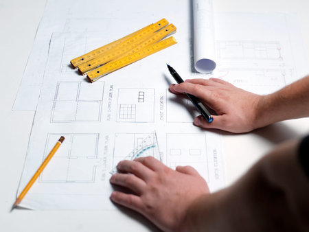 Business man draw buildings and present his architectural project