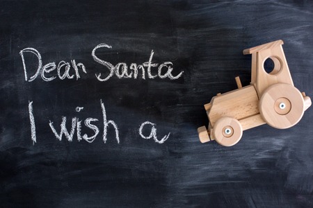 Dear Santa is written on a blackboard and christmas decorationの写真素材