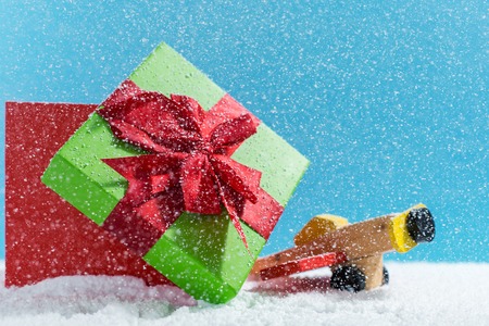 Christmas holiday concept with wooden toy and giftの写真素材