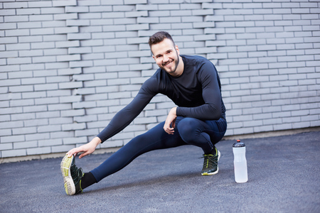 Handsome smiling man on a runningの写真素材